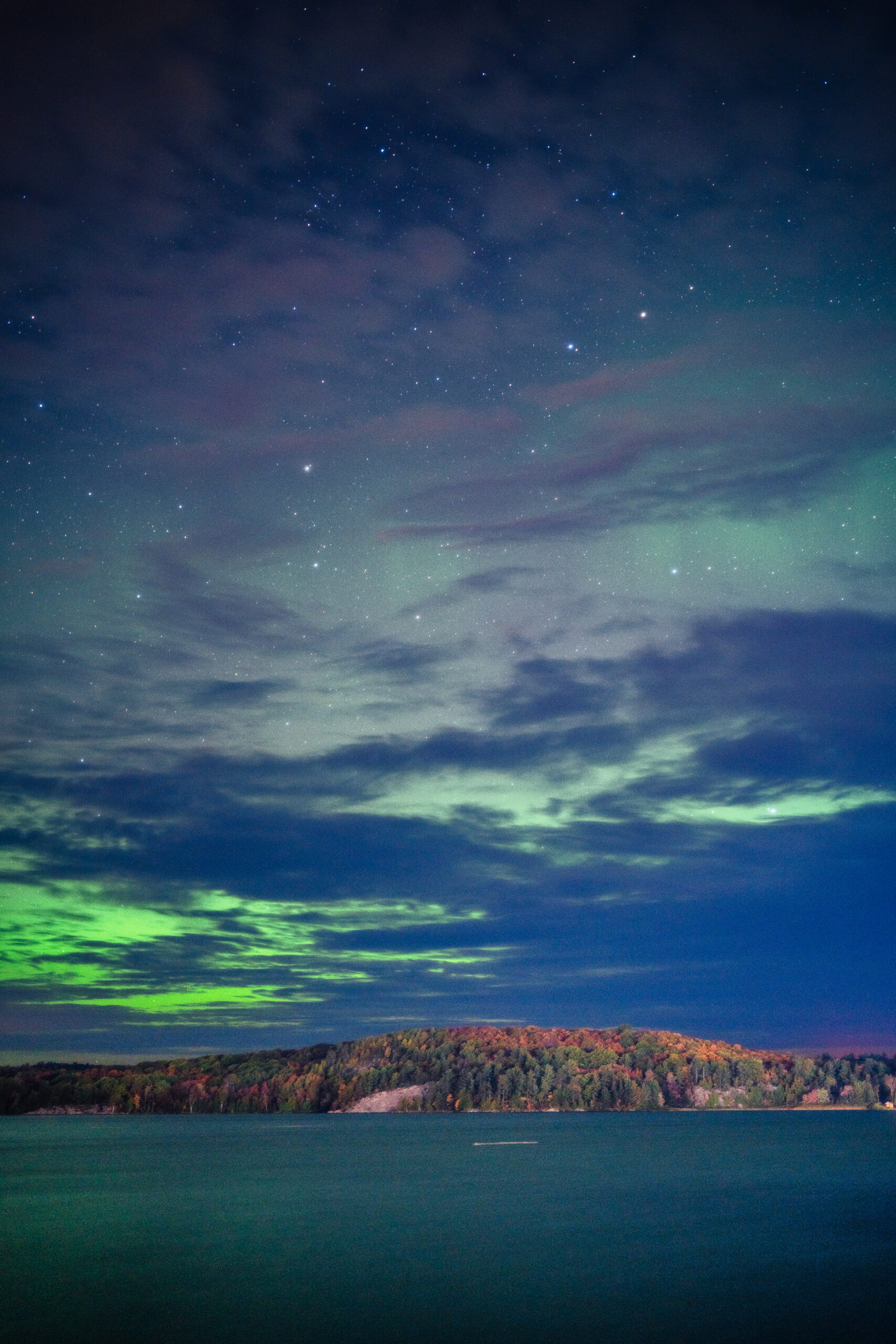 Night sky over a lake photographed with the Sony α7R V